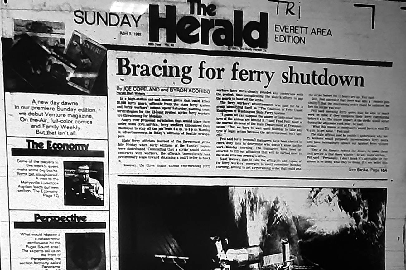 The Herald's first Sunday edition, shown here on a microfilm viewer, was published April 5, 1981. (Julie Muhlstein)