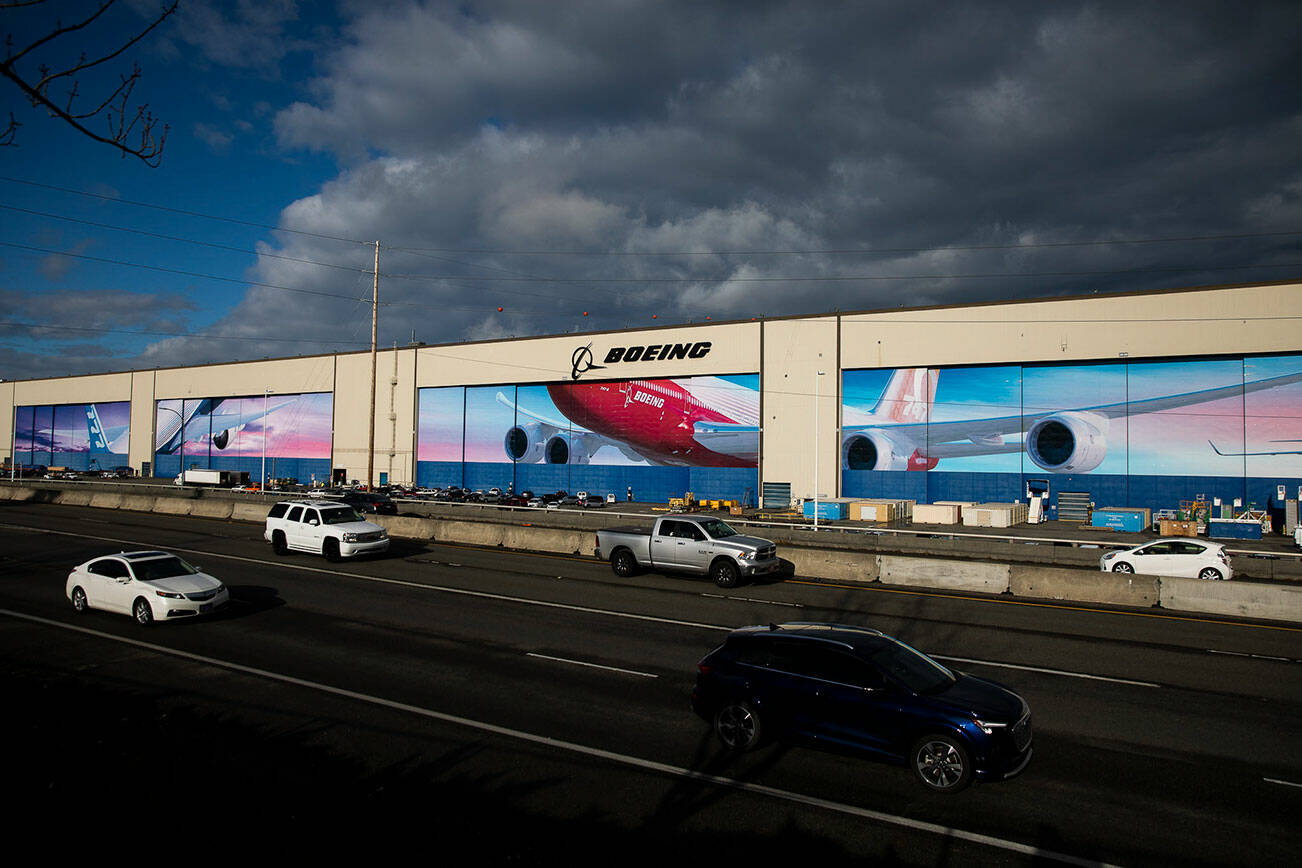 Traffic moves along Highway 526 in front of Boeing’s Everett Production Facility on Monday, Nov. 28, 2022 in Everett, Washington. (Olivia Vanni / The Herald)