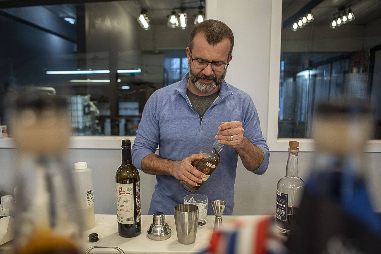 Ryan Hembre prepares a Spring Wish cocktail at Skip Rock Distillery on March 3, 2023 in Snohomish, Washington. Owners Ryan and Julie Hembre recently opened their new remodeled space and will be serving cocktails with their own spirits for the first time. (Annie Barker / The Herald)