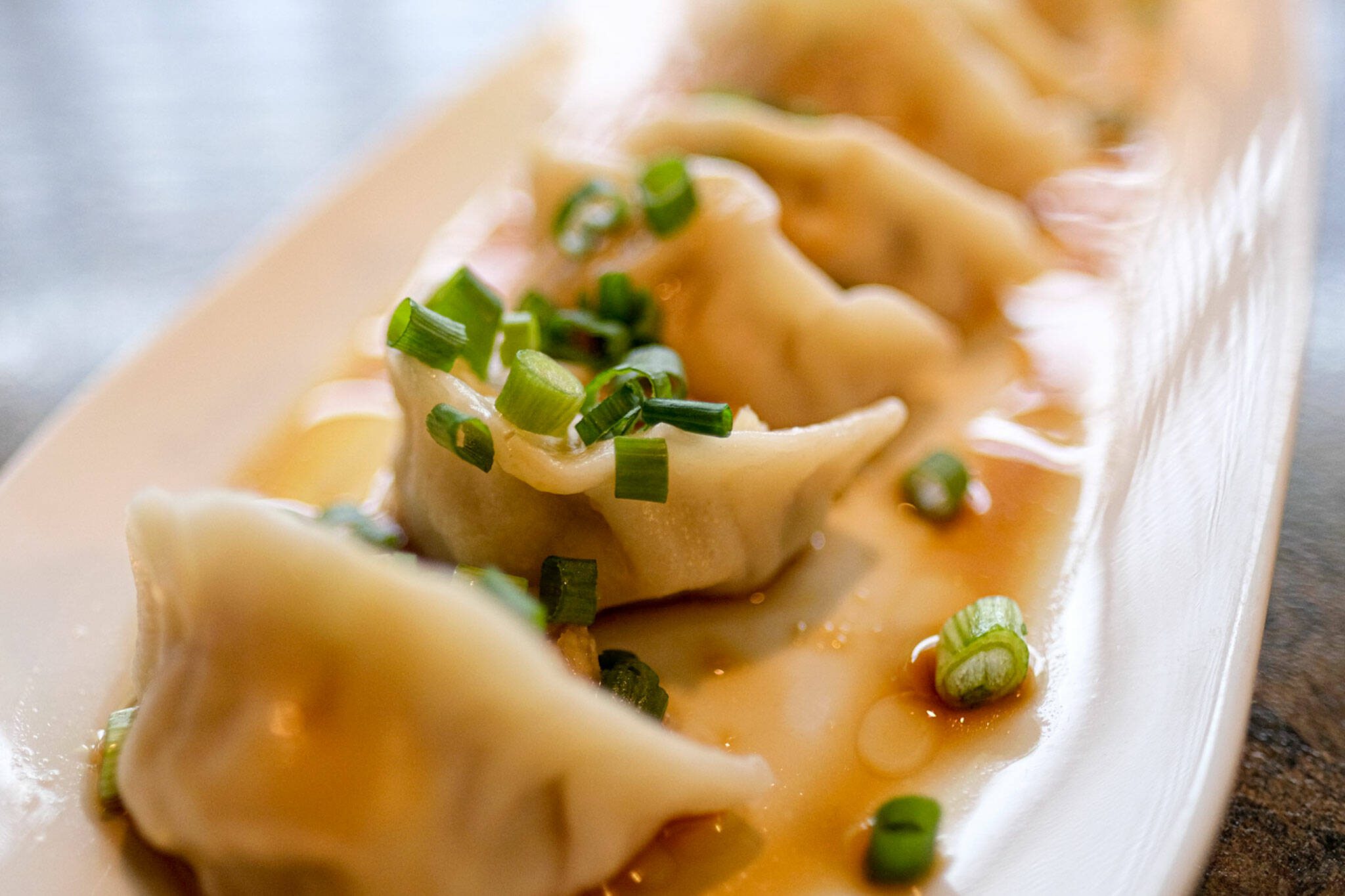 Pork dumplings are ready to be eaten at Bar Dojo in Edmonds on Monday, Jan. 24, 2022. (Taylor Goebel / The Herald)