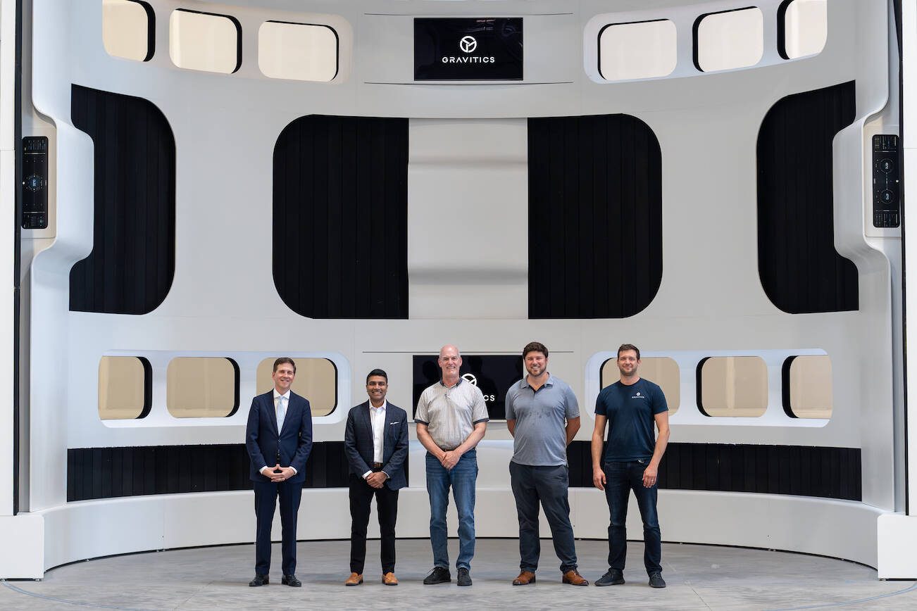 Members of Gravitics' team and U.S. Rep. Rick Larsen stand in front of a mockup of a space module interior on Thursday, August 17, 2023 at Gravitics' Marysville facility. Left to right: Mark Tiner, government affairs representative; Jiral Shah, business development; U.S. Rep. Rick Larsen; Mike DeRosa, marketing; Scott Macklin, lead engineer. (Gravitics.)