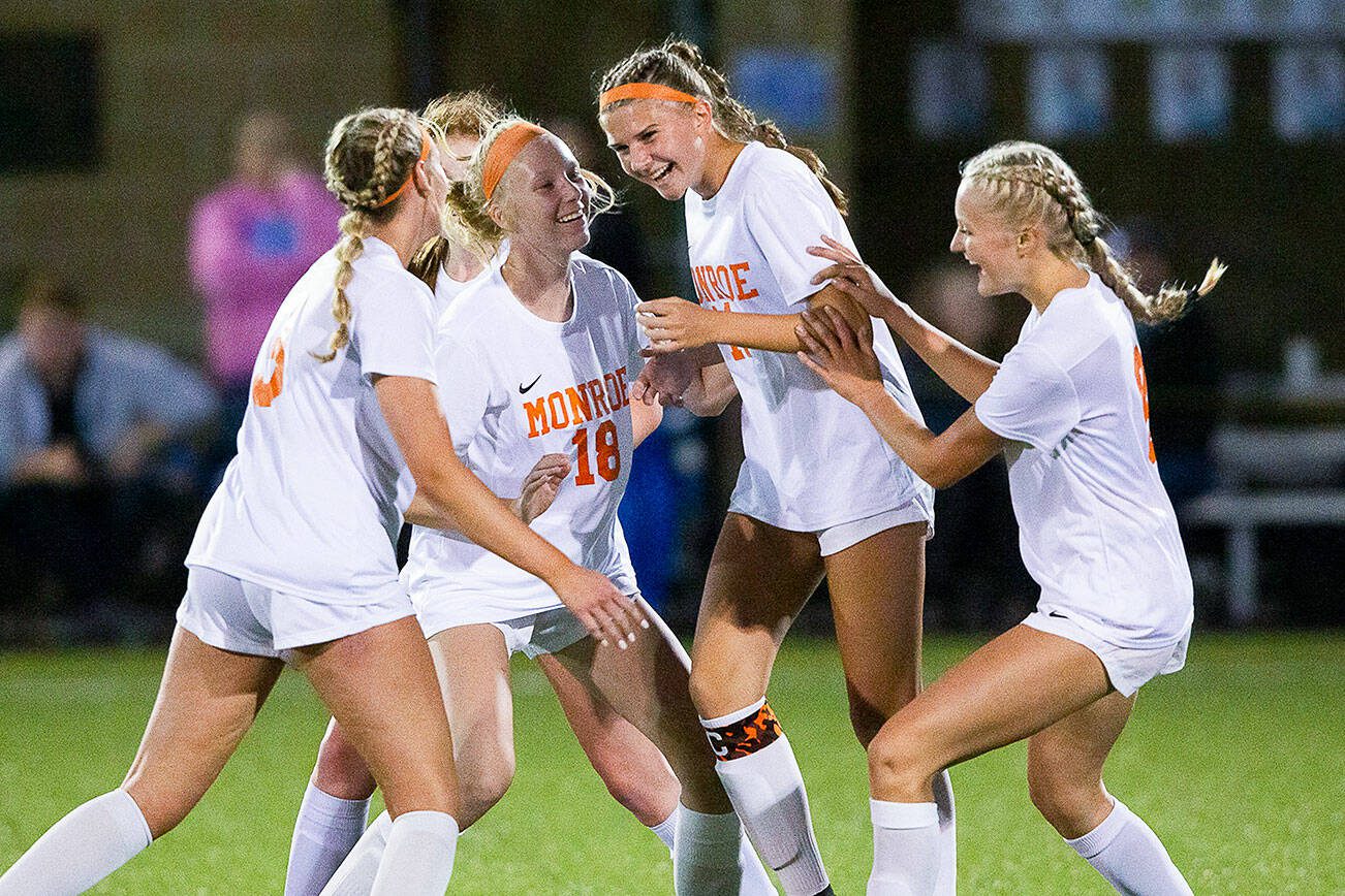 Monroe’s Sydney Garner celebrates her second goal with her teammates during the game Everett on Thursday, Sept. 7, 2023 in Everett, Washington. (Olivia Vanni / The Herald)