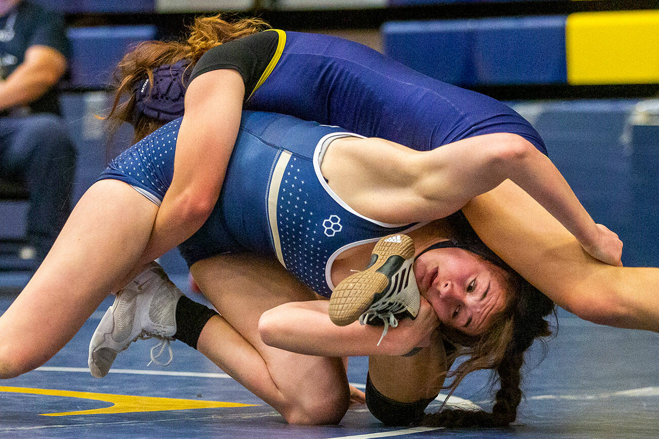 Arlington’s Danielle Crew wrestles during a wrestling scramble at Everett High School on Wednesday, Dec. 13, 2023 in Everett, Washington. (Olivia Vanni / The Herald)