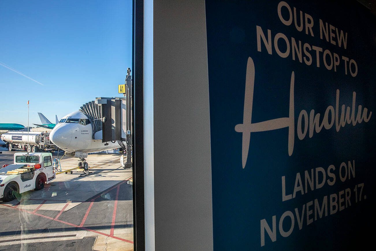 The first flight from Paine Field to Honolulu is prepared by grounds crew on Friday, Nov. 17, 2023 in Everett, Washington. (Olivia Vanni / The Herald)