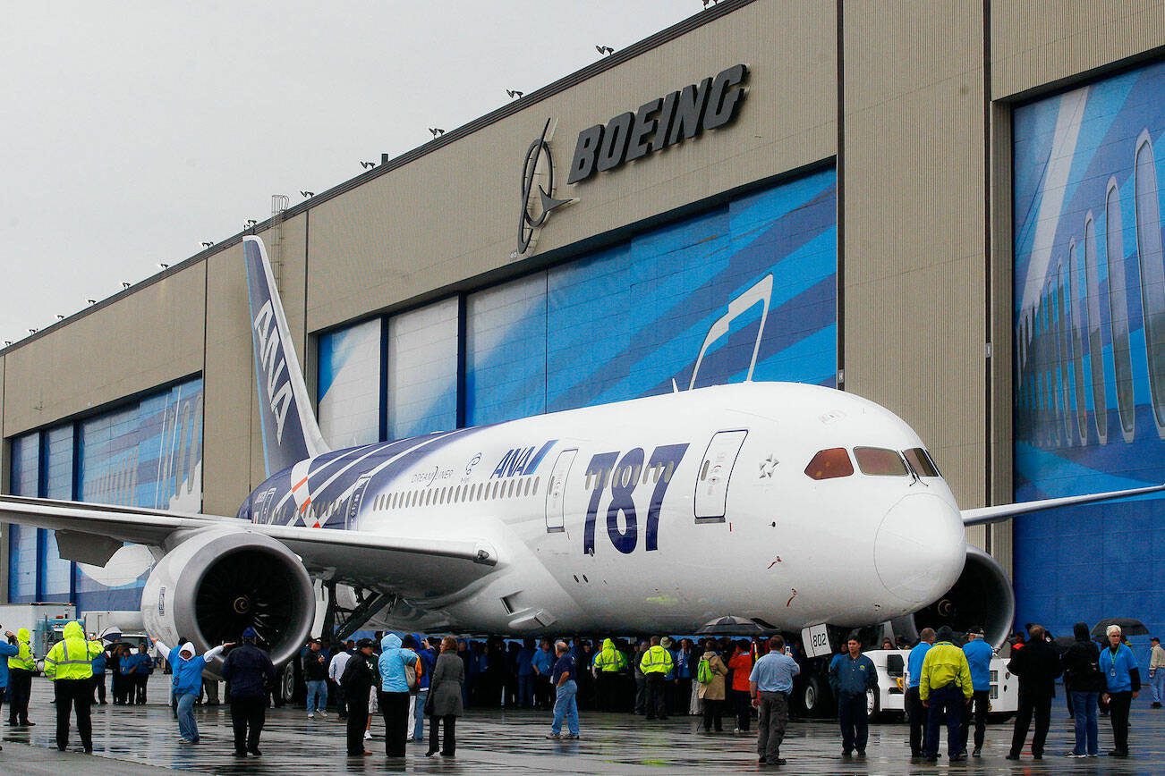 Michael O'Leary/The Herald
Hundreds of Boeing employees get ready to lead the second 787 for delivery to ANA in a procession to begin the employee delivery ceremony in Everett Monday morning.

photo shot Monday September 26, 2011