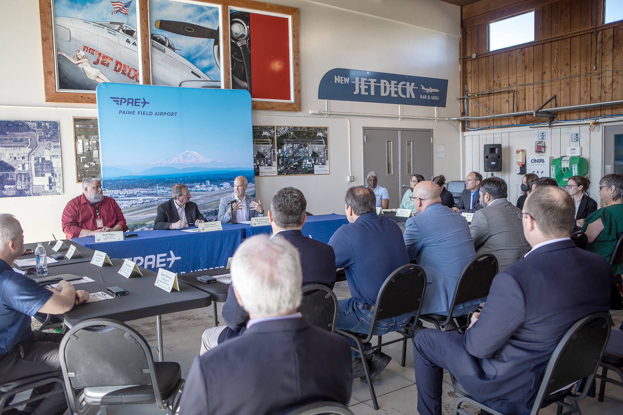 Rep. Rick Larsen, center, during a roundtable discussion at the Paine Field Airport Maintenance Department in Everett, Washington on Thursday, June 6, 2024. Members of the industry discussed how the FAA Reauthorization bill, signed into law last month, is expected to benefit Paine Field. (Annie Barker / The Herald)