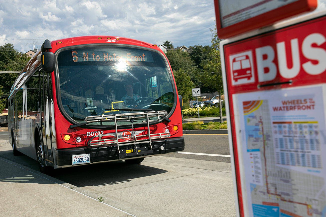 An Everett Transit Route 6 bus arrives at the 13th Street stop near the Port of Everett on Aug. 1, 2022, in Everett, Washington. (Ryan Berry / The Herald)