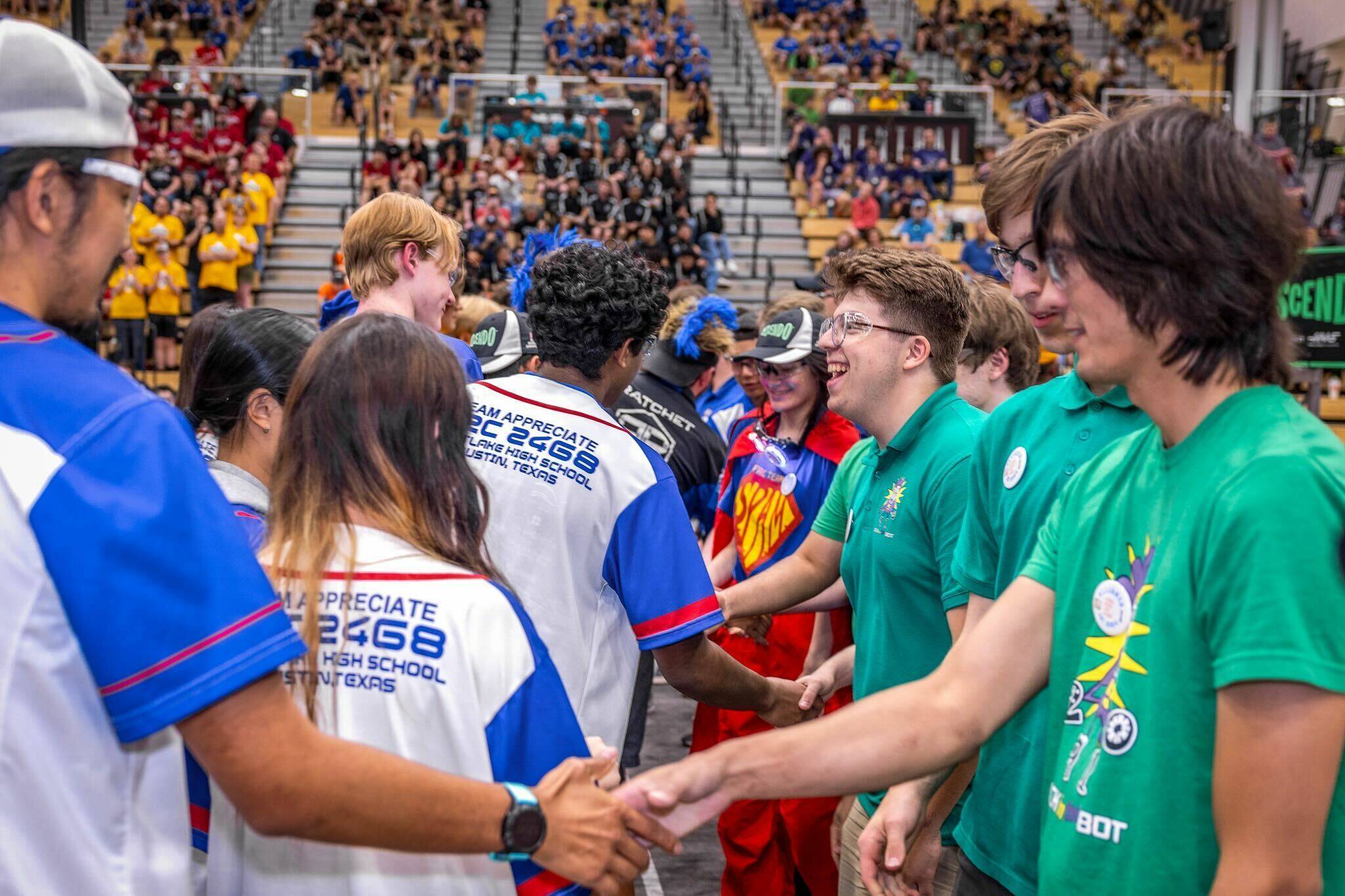 Henry M. Jackson High School’s robotic team, Jack in the Bot, shake hands at the 2024 Indiana Robotics Invitational. (Henry M. Jackson High School)