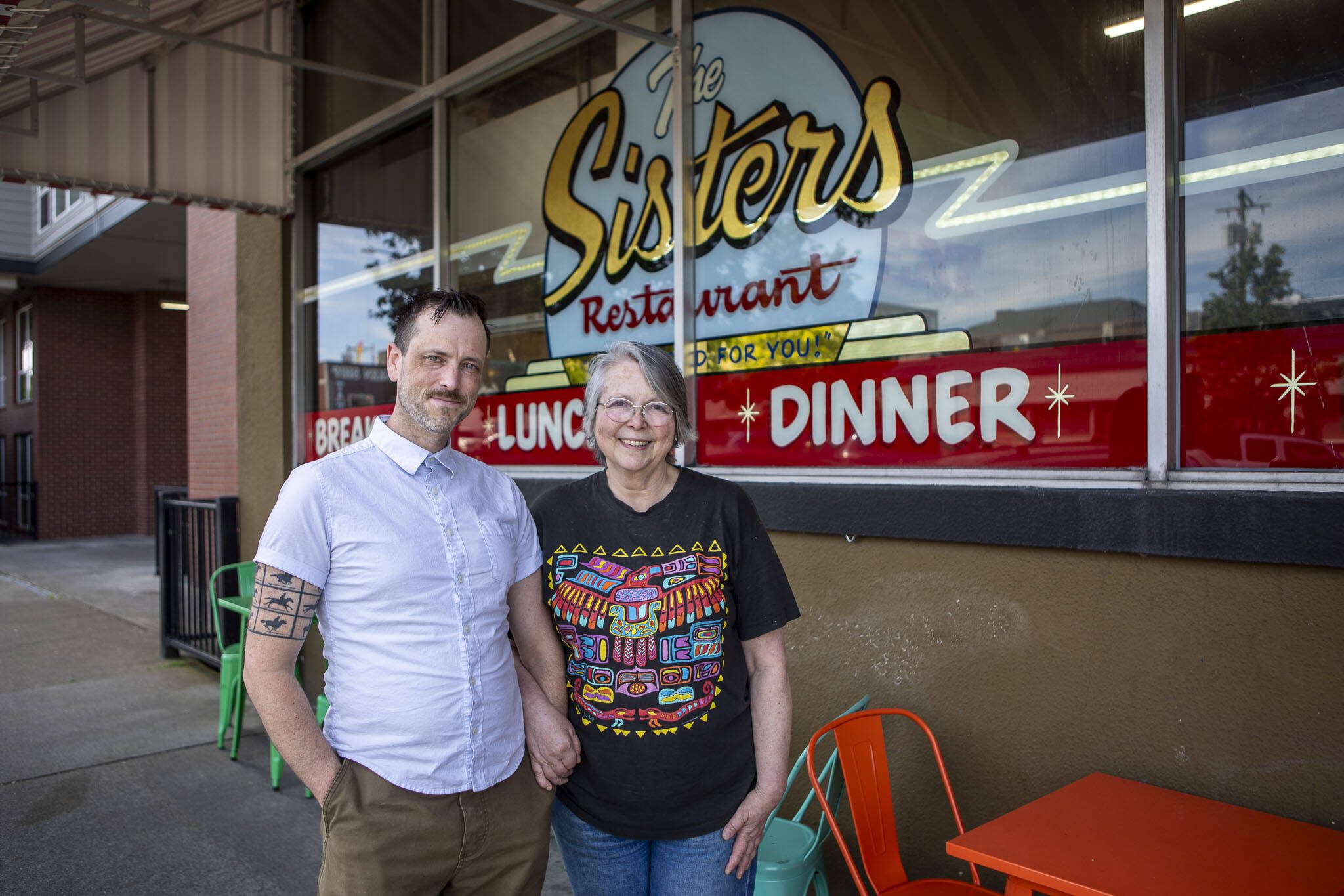 Jackson Quall, left, and Victoria “Tory” Quall, right, pose for a photo at the The Sisters Restaurant on Friday, June 21, 2024 in Everett, Washington. (Annie Barker / The Herald)