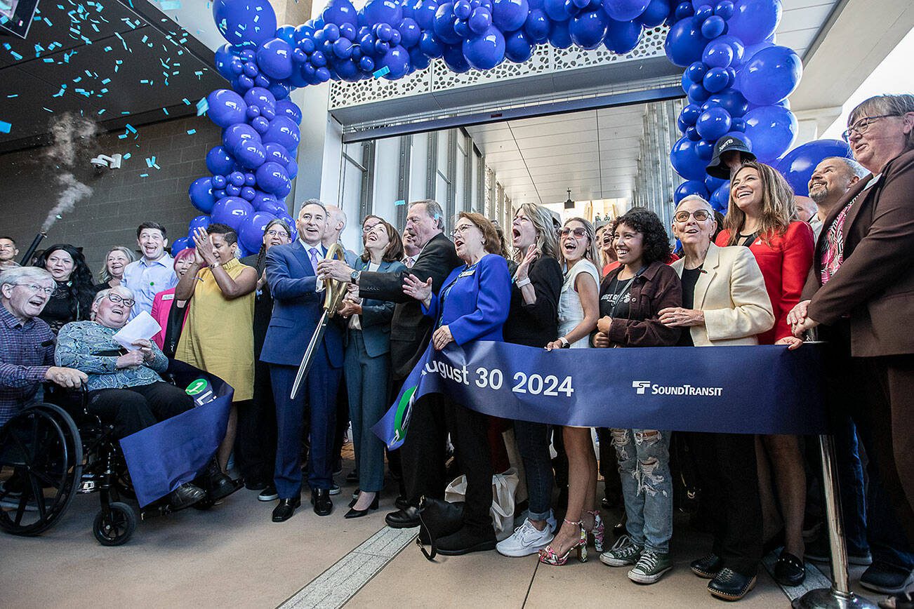 People cheer as ribbon is cut and confetti flys during the Lynnwood 1 Line extension opening celebrations on Friday, Aug. 30, 2024 in Lynnwood, Washington. (Olivia Vanni / The Herald)