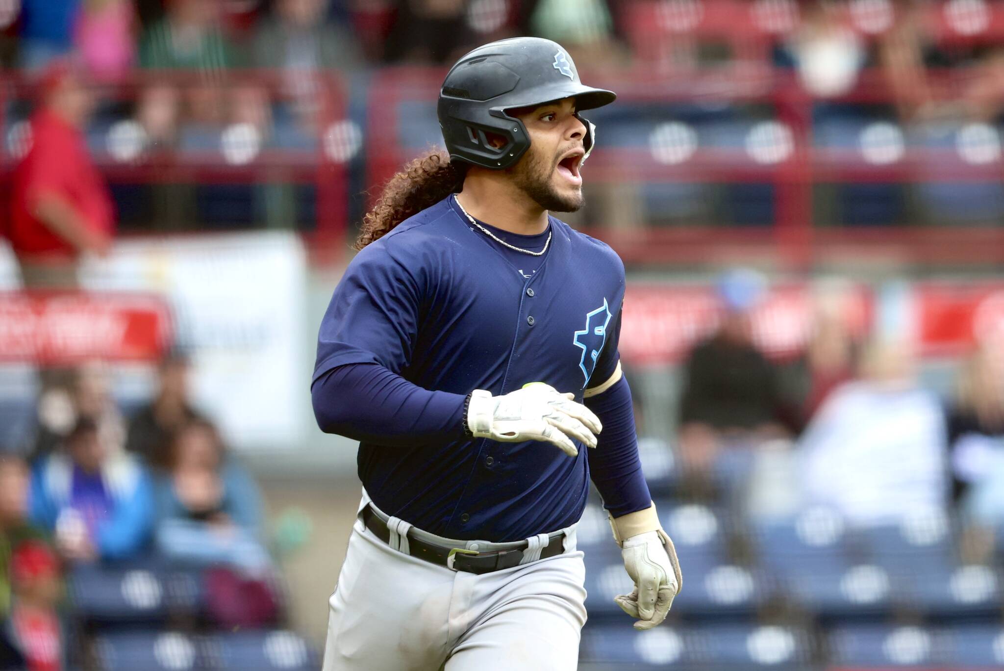 AquaSox catcher Freuddy Batista reacts while running down the first-base line during Everett’s game against the Vancouver Canadians on Friday, Aug. 23, at Nat Bailey Stadium in Vancouver, B.C. (Photo courtesy of Evan Morud / Everett AquaSox)