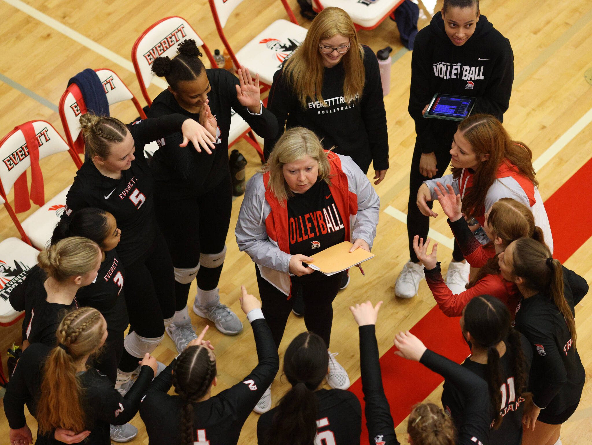 Everett Community College volleyball coach Whitney Williams talks to her team during a break in a match. Williams, who enters her fourth full season, is currently at 55 wins and has 15 matches remaining in the regular season to set a new all-time record. Williams could surpass former coach Robyn Peckol-Filimaua who served between 2012-18 and compiled 56 wins. (Photo courtesy of EvCC Athletic Director Garet Studer)