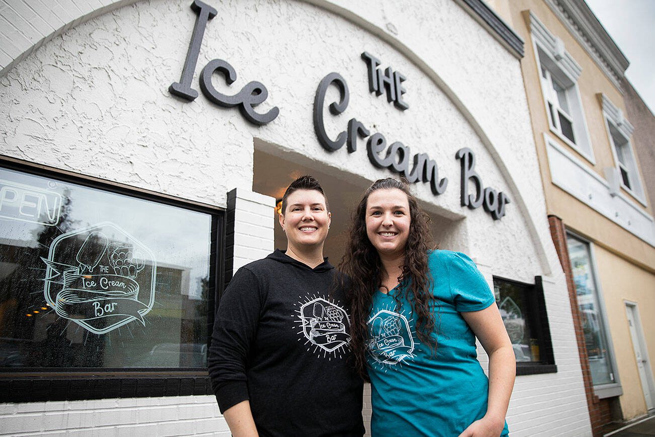 The Ice Cream Bar owners Lacie and Emily Nelson outside of their storefront on Friday, Oct. 18, 2024 in Everett, Washington. (Olivia Vanni / The Herald)