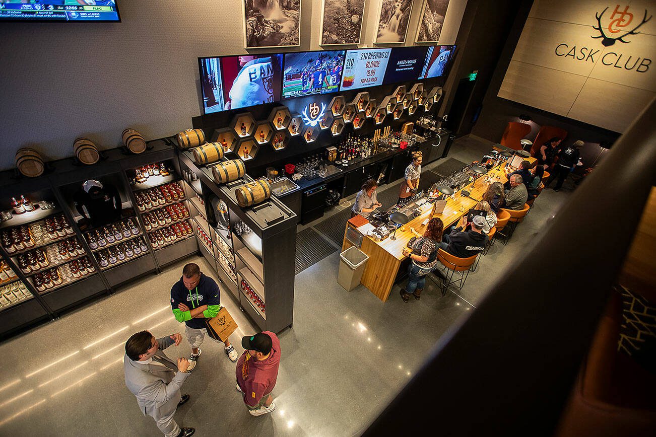 People enjoy the grand opening of the new Heritage Distillery tasting room at Angel of the Winds Casino on Friday, Oct. 25, 2024 in Arlington, Washington. (Olivia Vanni / The Herald)