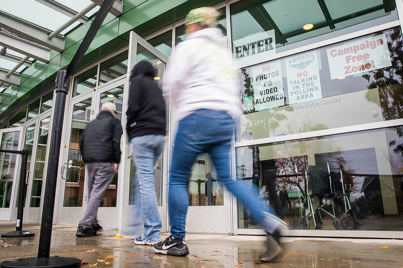 Boeing workers file into Angel of the Winds Arena to vote on the latest contract proposal from the company on Monday, Nov. 4, 2024 in Everett, Washington. (Olivia Vanni / The Herald)