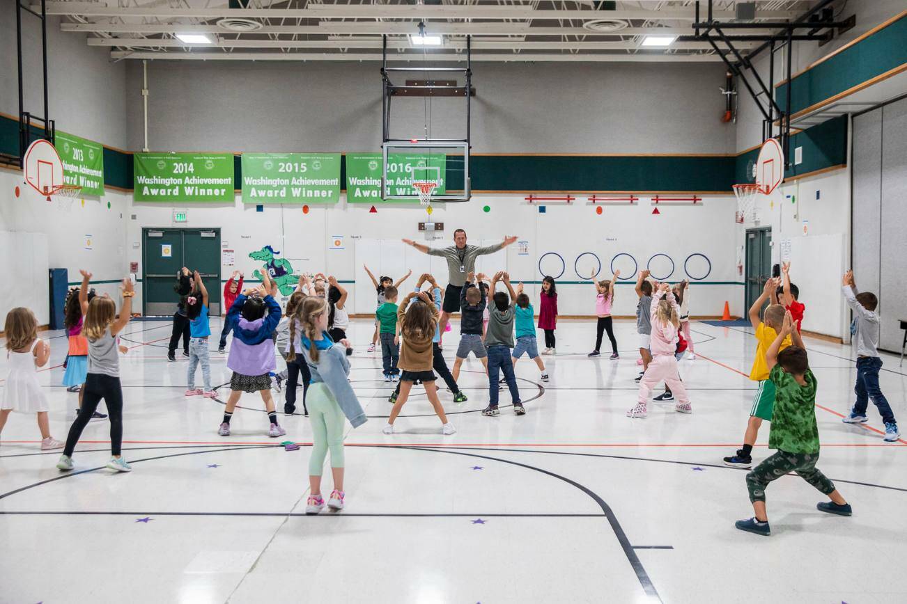 Students participate in P.E. class in the gym that also doubles as the cafeteria at Glenwood Elementary on Monday, Sept. 9, 2024 in Lake Stevens, Washington. (Olivia Vanni / The Herald)