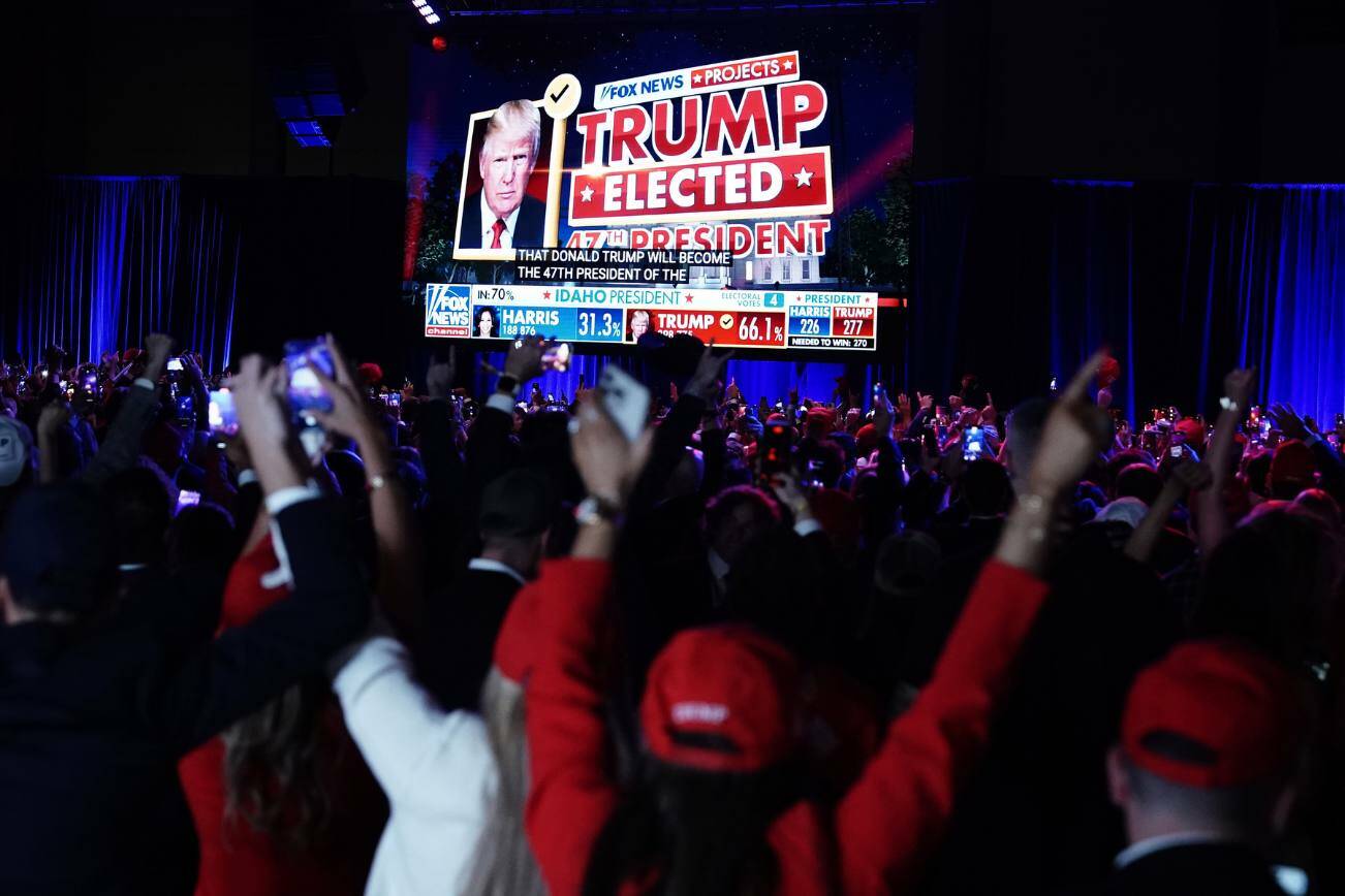 Attendees react after Fox News called the presidential race for Former President Donald Trump, during an election night event at the Palm Beach County Convention Center in West Palm Beach, Fla., on Wednesday. Trump made gains in every corner of the country and with nearly every demographic group. (Haiyun Jiang / The New York Times)