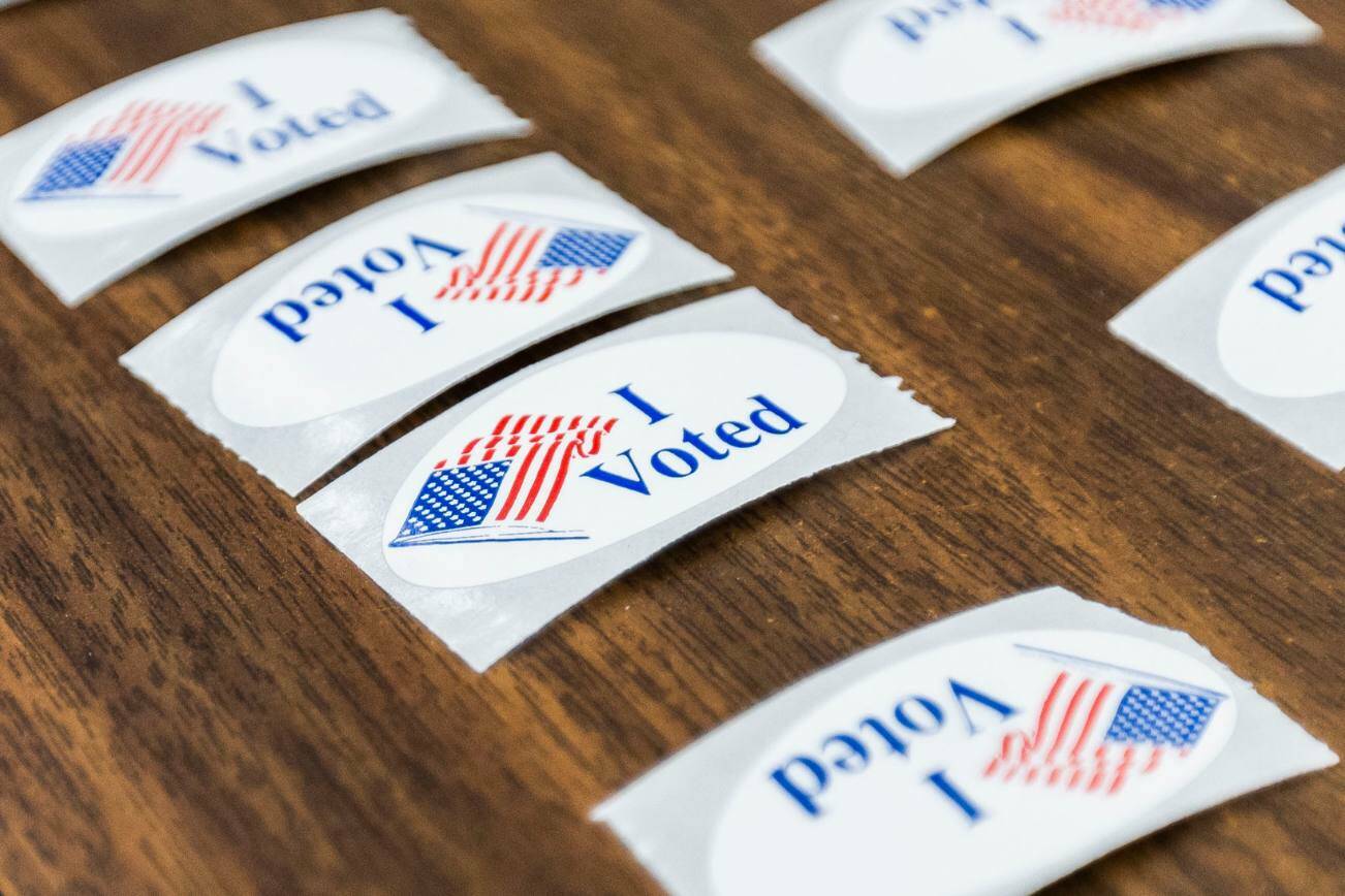 “I Voted” stickers cover a table at the entrance to the Snohomish County Auditor’s Office on Tuesday, Nov. 5, 2024 in Everett, Washington. (Olivia Vanni / The Herald)