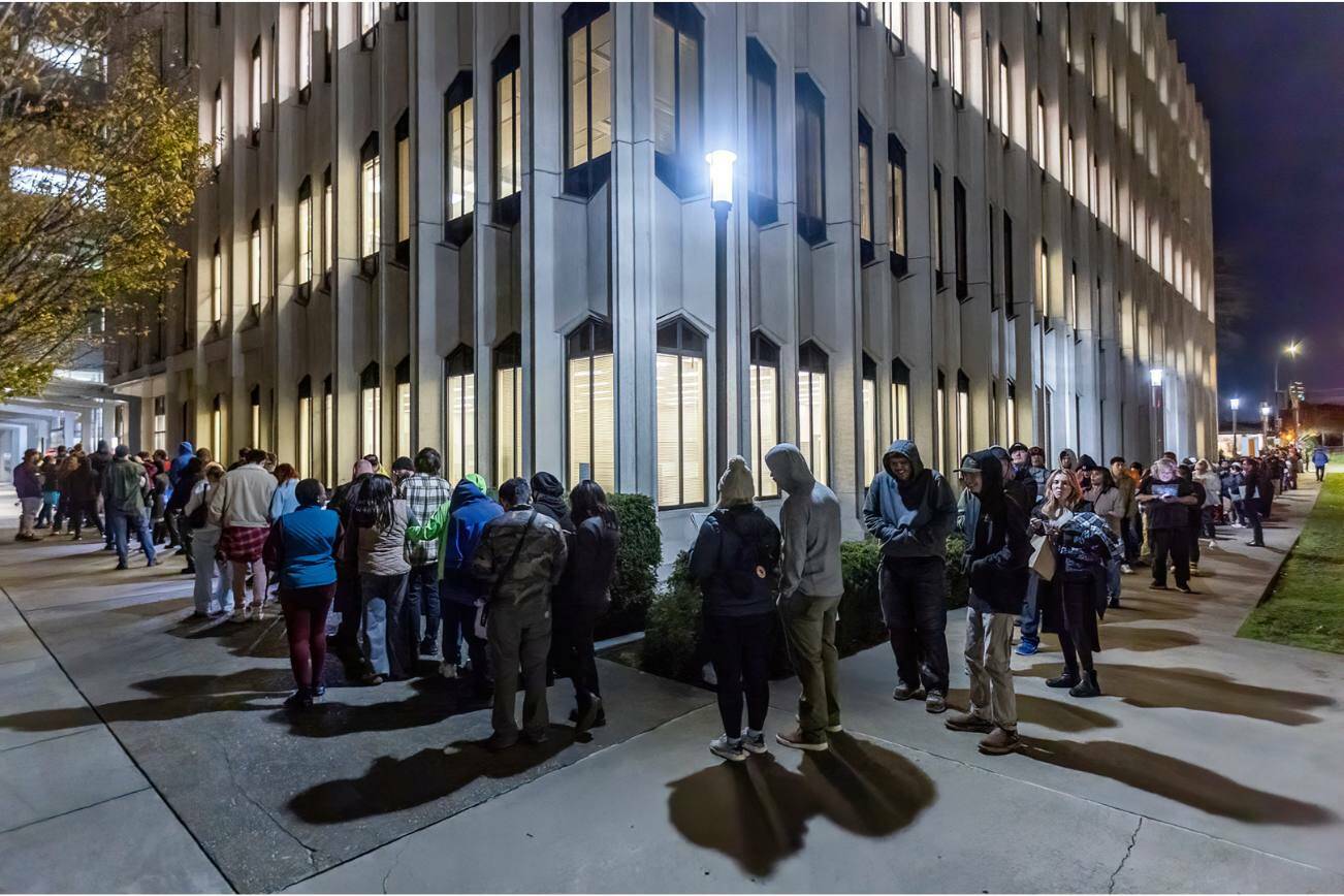 The line for the Snohomish County Auditor’s Office extends around the Admin West building and onto Pacific Avenue Election Day as people wait for same-day registration, ballot issuance, and accessible voting services on Tuesday, Nov. 5, 2024 in Everett, Washington. (Olivia Vanni / The Herald)