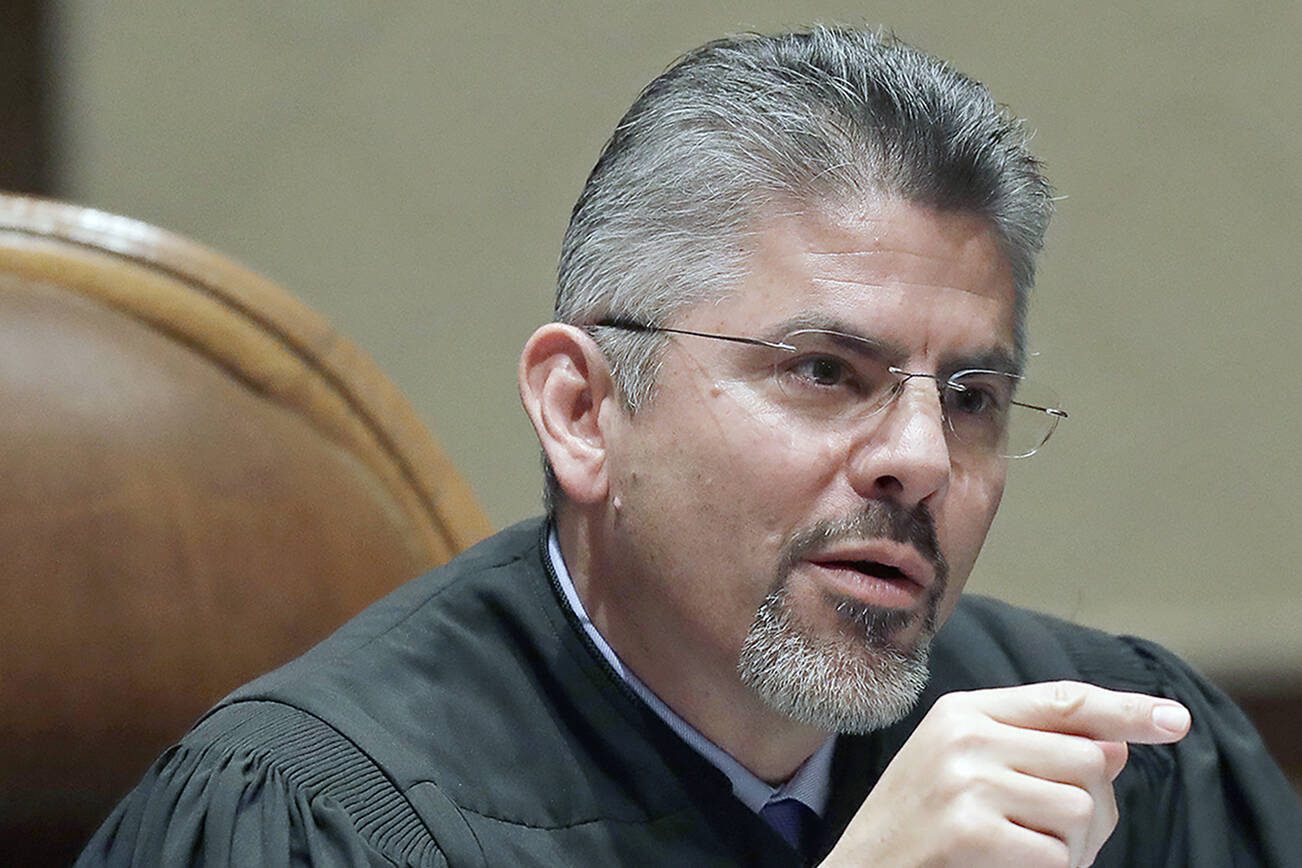 FILE - In this Jan. 22, 2019, file photo, Washington Supreme Court Justice Steven González listens to testimony during a hearing in Olympia, Wash. González has been elected as the next chief justice of the Washington state Supreme Court. He was elected by his colleagues on Thursday, Nov. 5, 2020, according to a news release sent by the court. (AP Photo/Ted S. Warren, File)