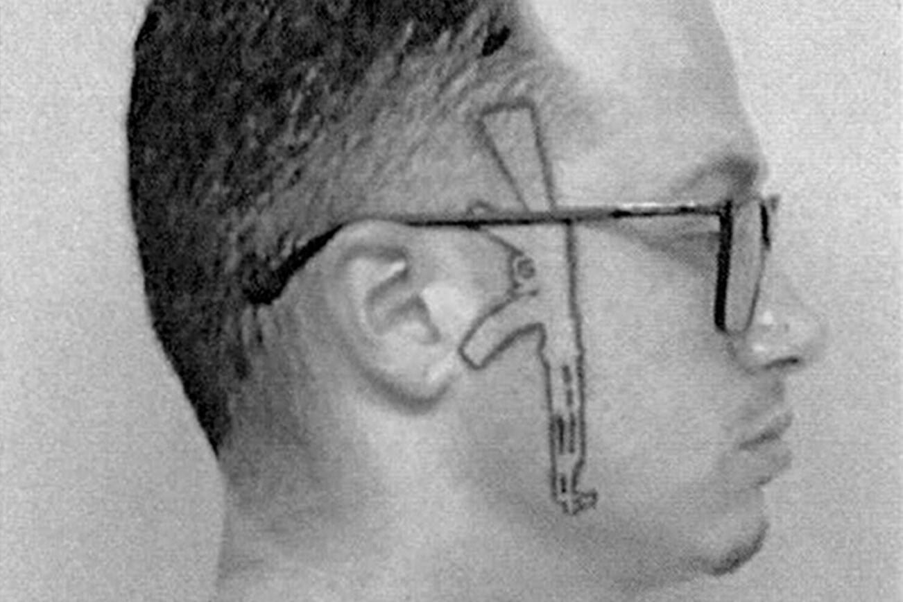 Lane Scott Phipps depicted with an AK-47 tattoo going down the side of his face. (Snohomish County Superior Court)