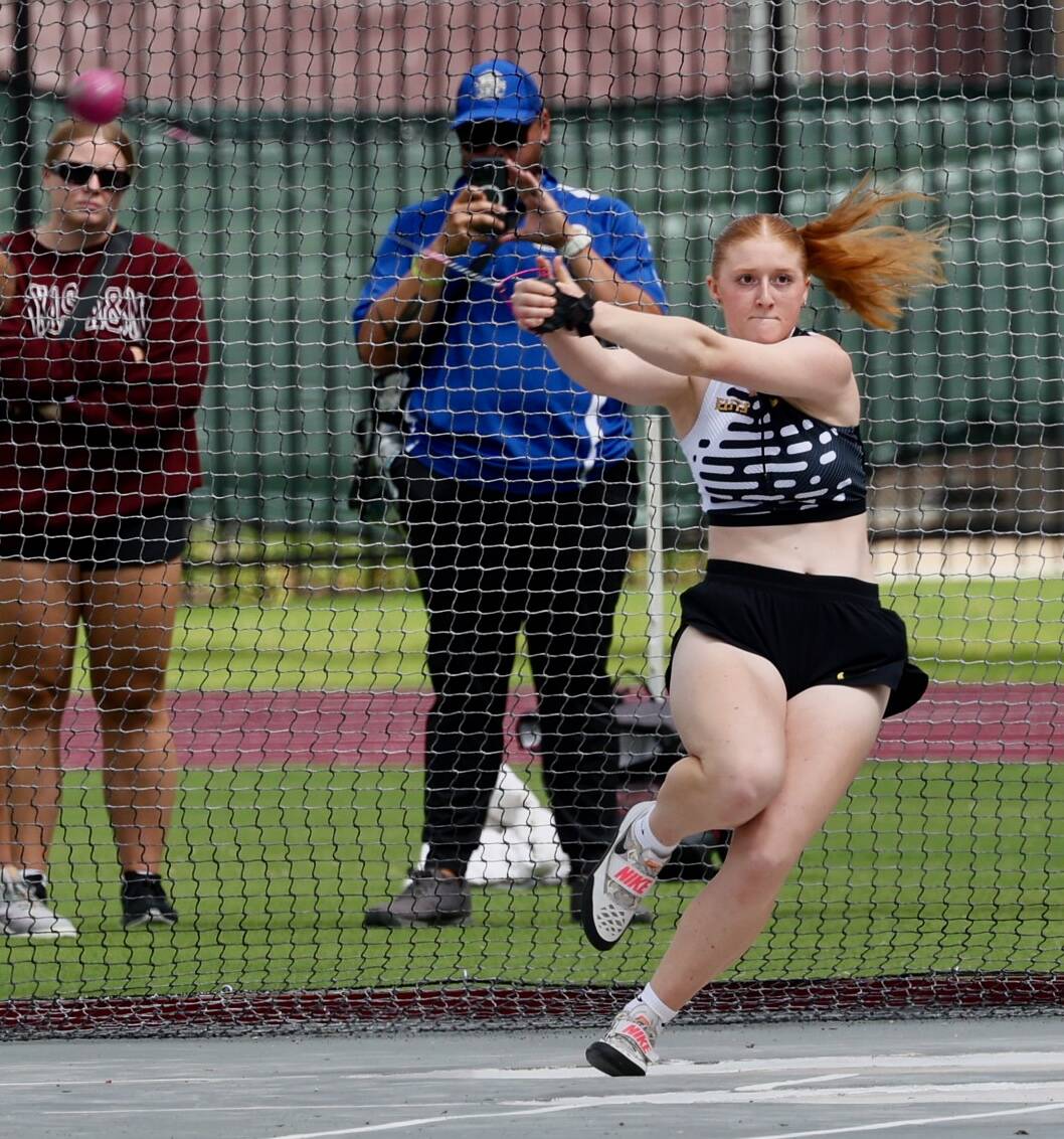 Kimberly Beard, the top-ranked high school hammer thrower in the country, prepares to release during a track and field event. (Photo courtesy of Donna Beard)