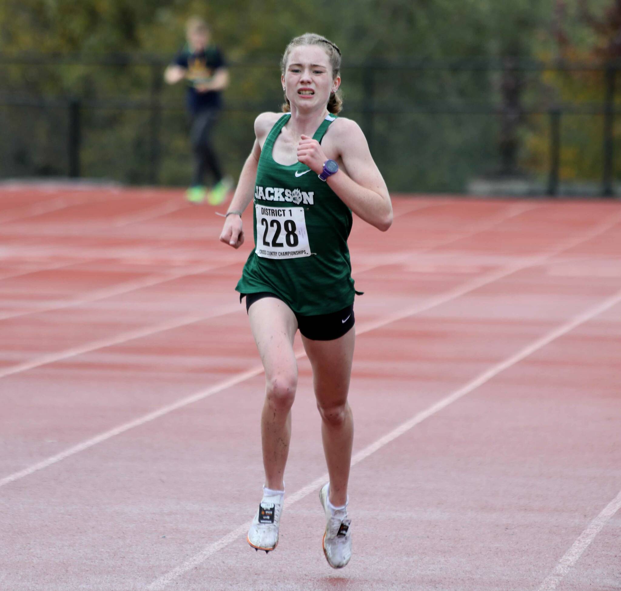 Jackson senior Selena Bangerter approaches the finish line during the District 1/2 Cross Country Championships at Lakewood High School in Arlington, Wash., on Nov. 2, 2024. Bangerter finished fourth in the 4A girls race. (Taras McCurdie / The Herald)