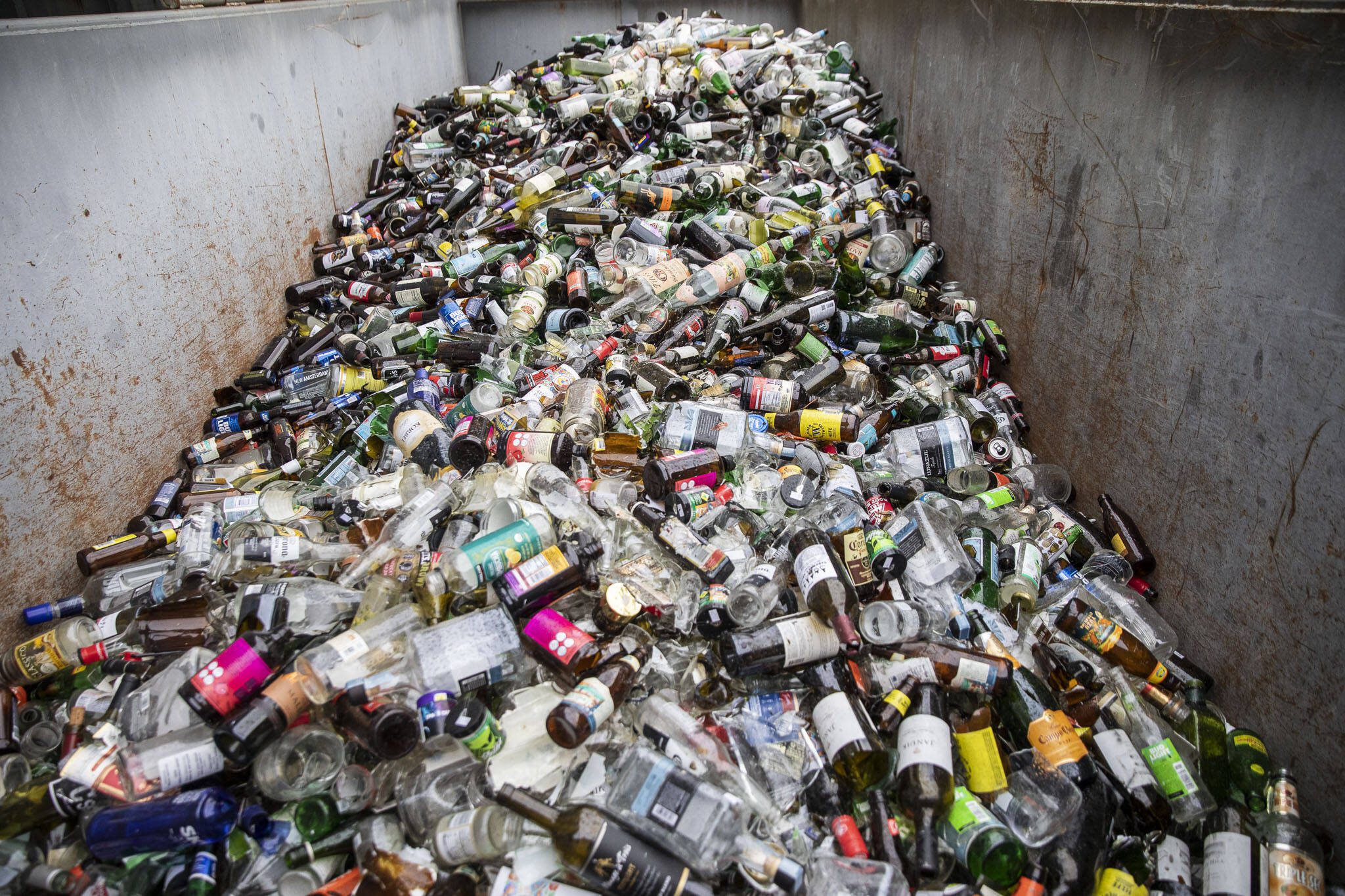 Glass recycling at Airport Road Recycling & Transfer Station on Thursday, Nov. 30, 2023 in Everett, Washington. (Olivia Vanni / Herald file)