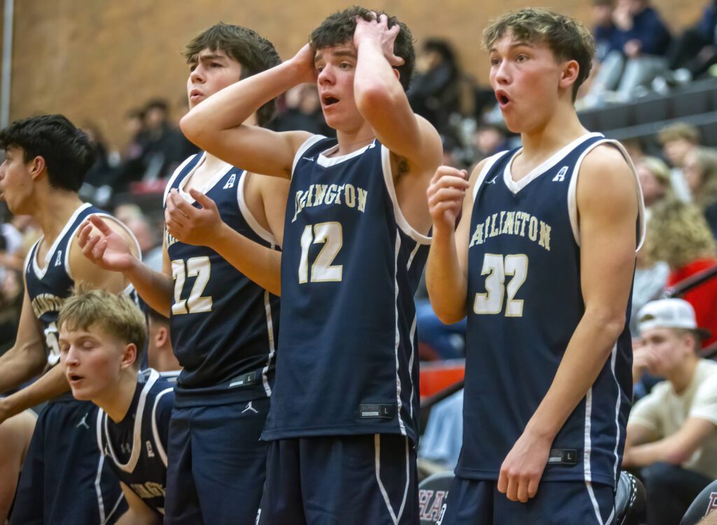 The Arlington bench reacts to a call during the game against Mountlake Terrace on Tuesday, Dec. 10, 2024 in Mountlake Terrace, Washington. (Olivia Vanni / The Herald)
