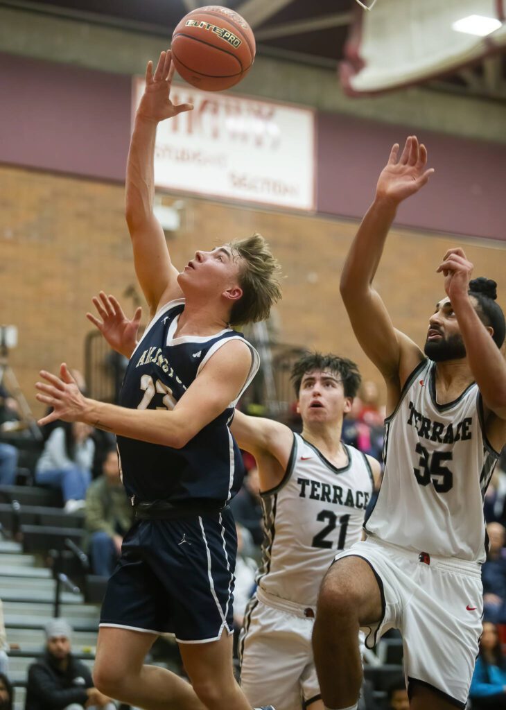 Arlington’s Leyton Martin makes a lay up during the game against Mountlake Terrace on Tuesday, Dec. 10, 2024 in Mountlake Terrace, Washington. (Olivia Vanni / The Herald)
